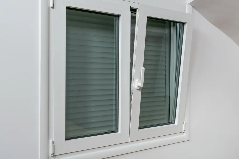 uPVC tilt and turn window in tilt position, interior view in a Glasgow home