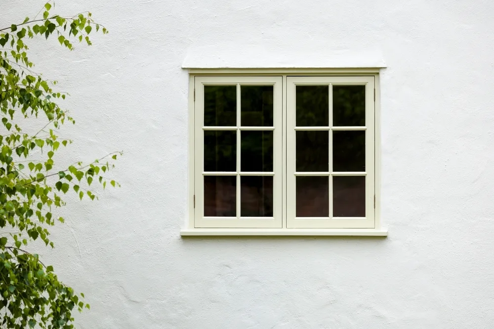 White uPVC casement windows on a house exterior in Glasgow
