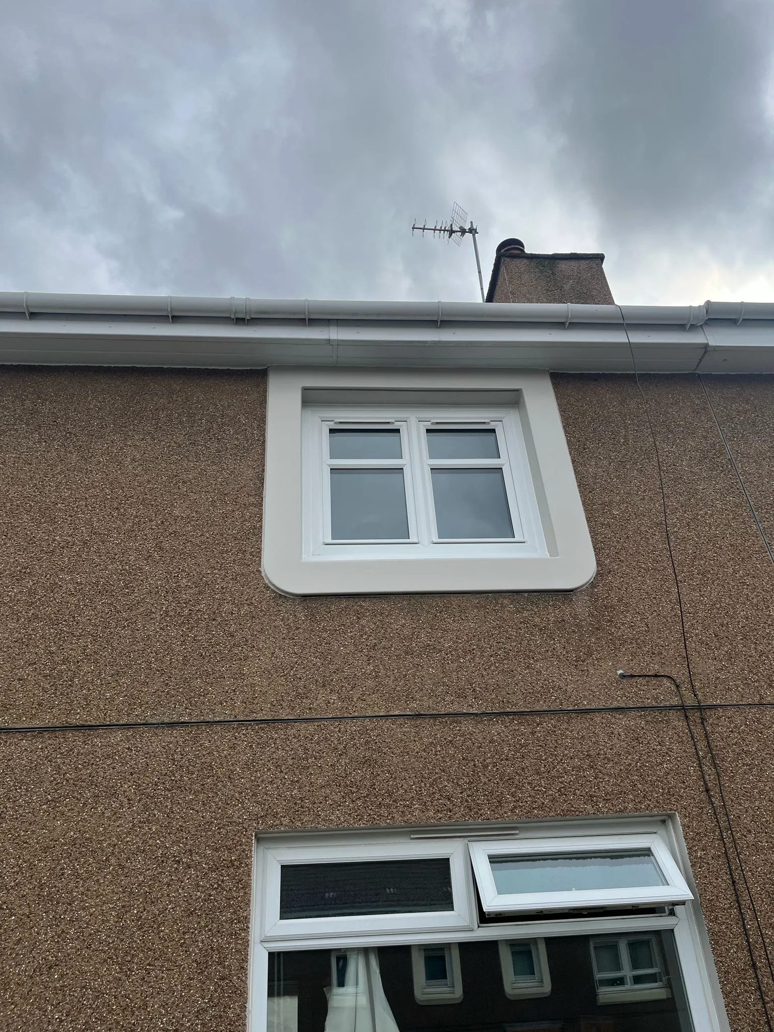White uPVC tilt and turn window seen from outside